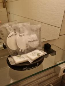 a glass counter with towels in plastic bags on it at majorana home in Naples +22 photos