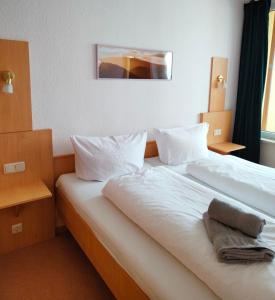 Postel nebo postele na pokoji v ubytování Apartment Brockenblick mit tollen Blick und Schwimmbad