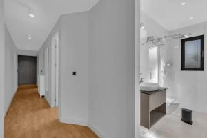 a white bathroom with a sink and a mirror at Apartmani Vila Jelena 1 - Makarska Exklusiv in Makarska +39 photos
