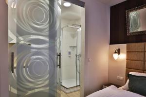a bathroom with a shower and a toilet at VIP Apartments in Bratislava