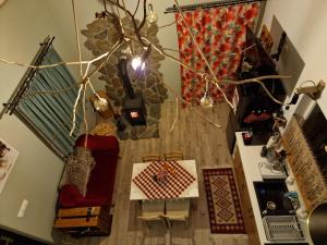 an overhead view of a living room with a table and chairs at RUDY RYDZ in Ropienka