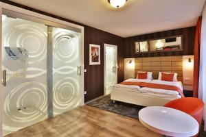 Posteľ alebo postele v izbe v ubytovaní VIP Apartments