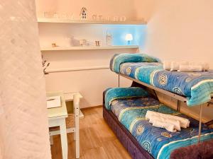 A bed or beds in a room at Casa Clarò