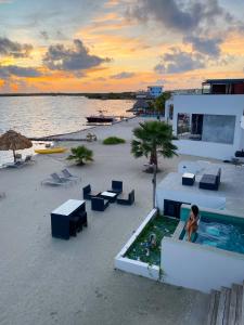 a person standing in a swimming pool on a beach at Playa De Sala Boutique Hotel, Adults Only in San Pedro