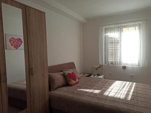 Postel nebo postele na pokoji v ubytování Apartment Dusica + 4 fotografie