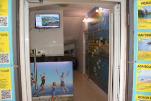 a window of a gym with posters on the wall at Montenegro Backpackers Home Budva in Budva