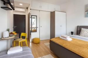 Ένα ή περισσότερα κρεβάτια σε δωμάτιο στο Cibona Station Apartments
