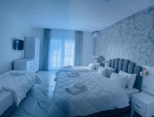 Postel nebo postele na pokoji v ubytování UJVARA HOTEL