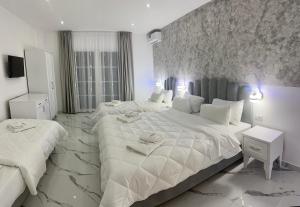 Postel nebo postele na pokoji v ubytování UJVARA HOTEL