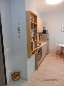 a small kitchen with a counter and a table at Апартамент Нова Дружба 2 in Sofia