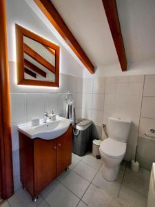 A bathroom at Barbati balcony view