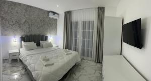Postel nebo postele na pokoji v ubytování UJVARA HOTEL