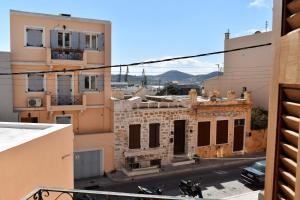 a view from the balcony of an old building at Siel Oneiro House in Ermoupoli