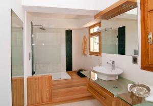 a bathroom with a sink and a shower at Lycia Hotel in Kaş