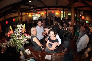 a group of people standing in a room at The Harrietville Snowline Hotel in Harrietville
