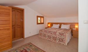 a bedroom with a bed with a wooden head board at Lycia Hotel in Kaş