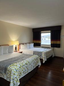 Postel nebo postele na pokoji v ubytování Scottish Inns Ashland
