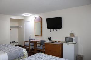 Postel nebo postele na pokoji v ubytování Scottish Inns Ashland