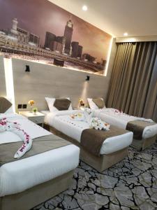 Postel nebo postele na pokoji v ubytování فندق اسكنت الحفاير - Askant Al Hafayer Hotel + 14 fotografií