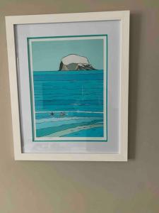 a picture of a painting on a wall at The Beach Pad North Berwick in North Berwick