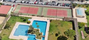 an overhead view of a pool with red solar panels on it at PANORAMIC VIEW in Benidorm