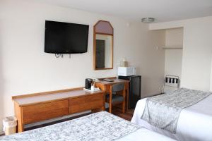 Postel nebo postele na pokoji v ubytování Scottish Inns Ashland
