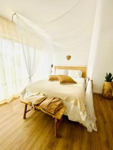 a bedroom with a large bed and a window at Caparica Rooftop Beach Apartment in Costa da Caparica +36 photos
