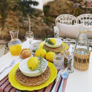 a table with plates of food on top of it at Villa Tauria- Casa de campo em aldeia medieval in Sabugal
