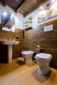 a bathroom with a toilet and a sink at Villa MiraMar Luxury Suite Palermo Airport in Carini
