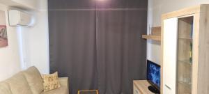 Televízia a/alebo spoločenská miestnosť v ubytovaní PANORAMIC VIEW