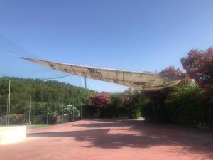 awning over a parking lot in a park at Gargano Vacanza in Peschici