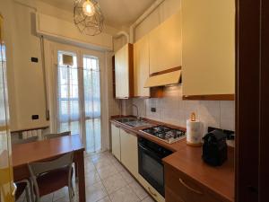 a kitchen with a counter and a stove top oven at Relax Segrate in Segrate
