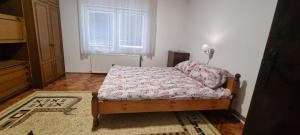 Postel nebo postele na pokoji v ubytování Apartman Sims