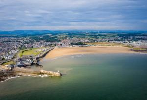 an aerial view of a beach and the ocean at Amore Caravans in Porthcawl