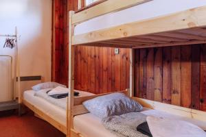 A bed or beds in a room at Chata pod Sedlom Čertovica