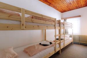 A bed or beds in a room at Chata pod Sedlom Čertovica