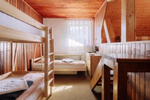 A bed or beds in a room at Chata pod Sedlom Čertovica