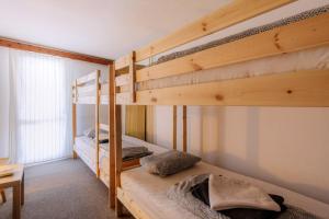 A bed or beds in a room at Chata pod Sedlom Čertovica