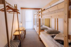 A bed or beds in a room at Chata pod Sedlom Čertovica