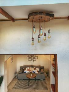 a living room with a couch and a table at Къща за гости Катрин in Veliko Tŭrnovo