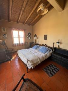 מיטה או מיטות בחדר ב-Finca Dos Lagos