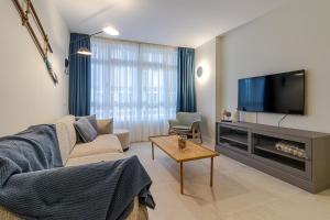 Televízia a/alebo spoločenská miestnosť v ubytovaní Apartamento El Peñón + 26 fotografií