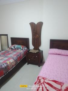 A bed or beds in a room at شقق فندقية علي البحر مباشرة عائلات فقط