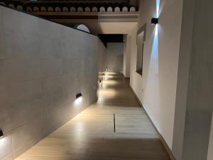 a hallway in a building with lights on the wall at Villa Antonia Mar - Punta Lara Nerja in Nerja