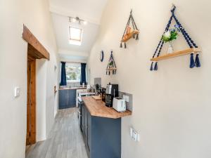 a kitchen with blue cabinets and a counter at The Granary in Arlington