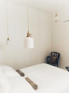 Postel nebo postele na pokoji v ubytování Maison Victoire, boutique hôtel - Pointe-à-Pitre