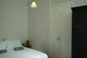 Postel nebo postele na pokoji v ubytování Maison Victoire, boutique hôtel - Pointe-à-Pitre