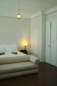 Postel nebo postele na pokoji v ubytování Maison Victoire, boutique hôtel - Pointe-à-Pitre