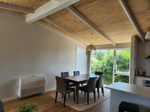 a dining room with a table and chairs at Beautifully renovated townhouse, easy walk to CBD in Blenheim
