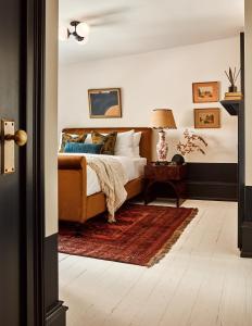 a bedroom with a bed and a rug at Guild House Hotel in Philadelphia